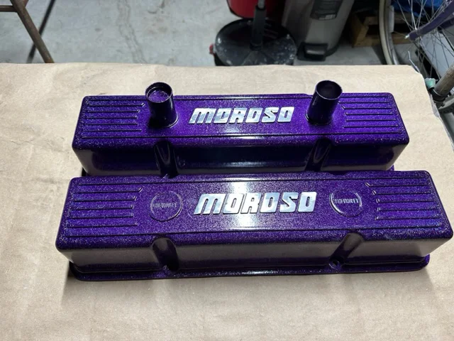 Aluminum valve covers blasted then coated candy purple