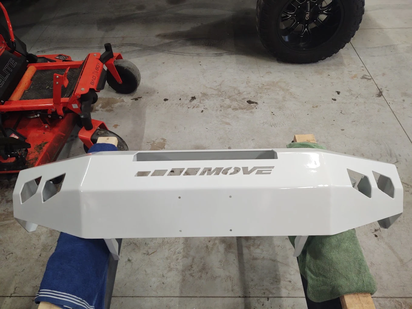 Truck bumper stripped and finished in gloss white