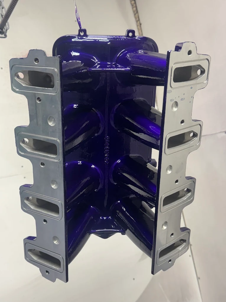 Aluminum intake manifold blasted and coated purple